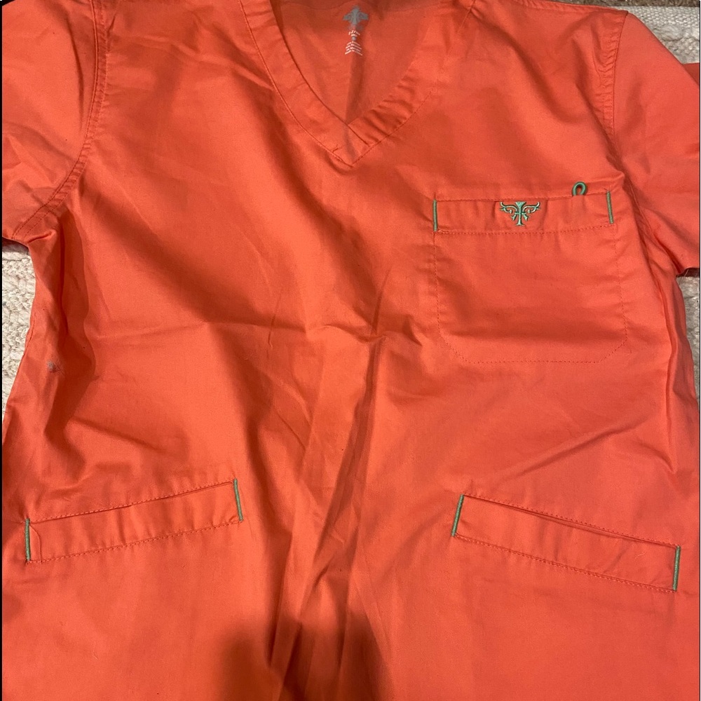 Med couture peach colors top